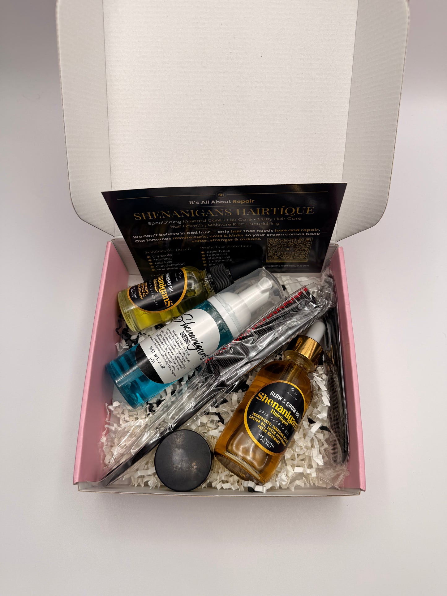 Set of Hair care product bundle including 2oz glow and grow oil, 1 oz rosemary oil, edge brush/detangling brush, hair mousse