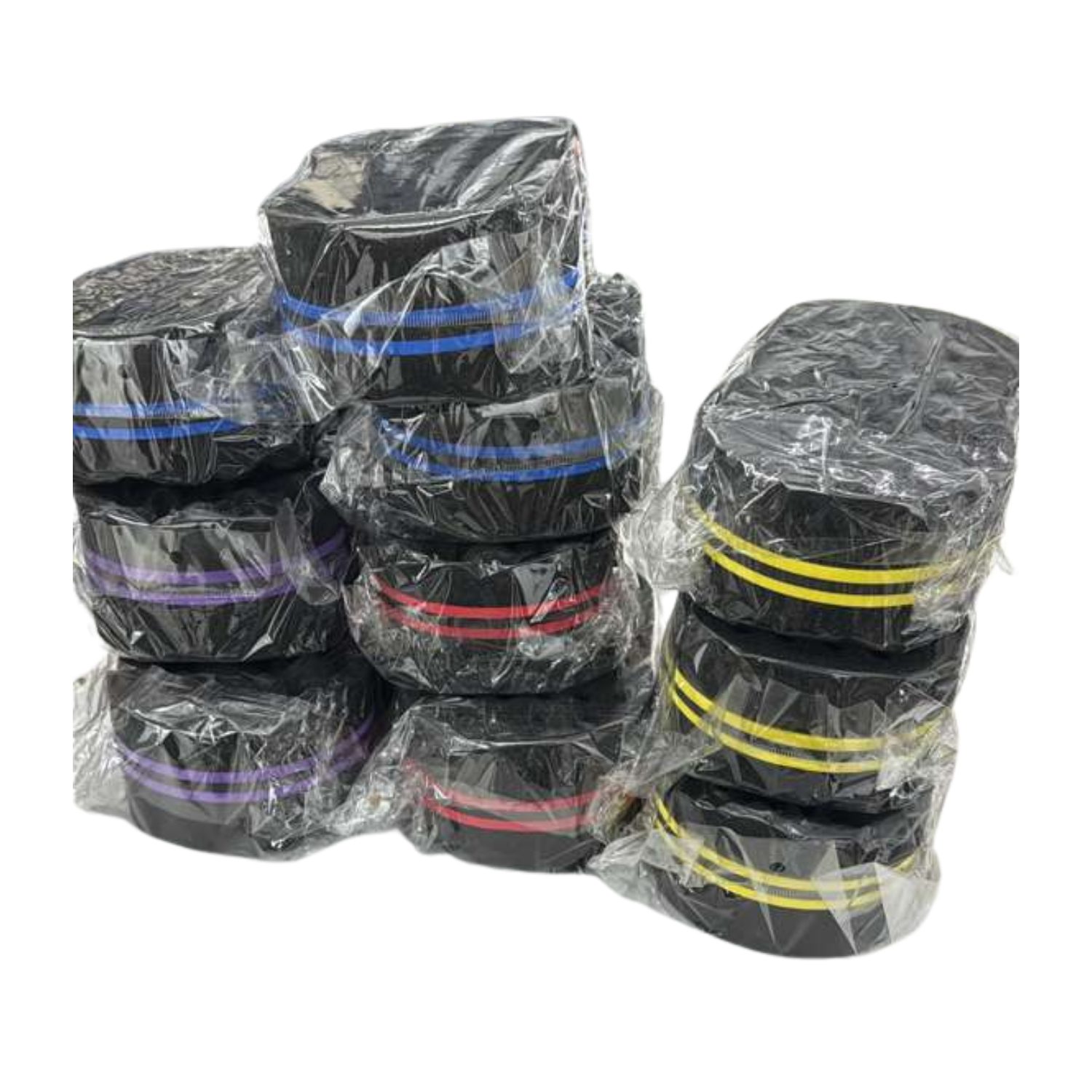 Stacks of black curl Sponge / Hair Twist Sponge on white background with colored stripes on a white background