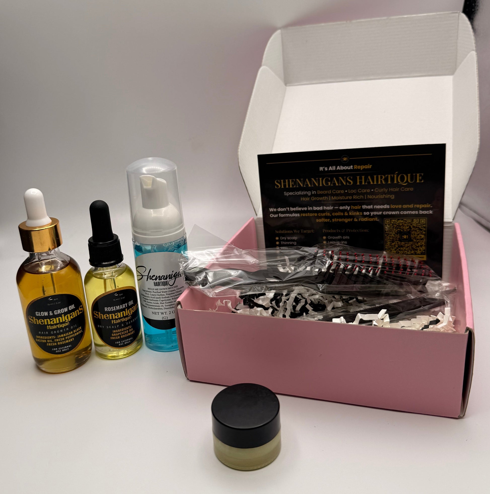 Set of Hair care product bundle including 2oz glow and grow oil, 1 oz rosemary oil, edge brush/detangling brush, hair mousse