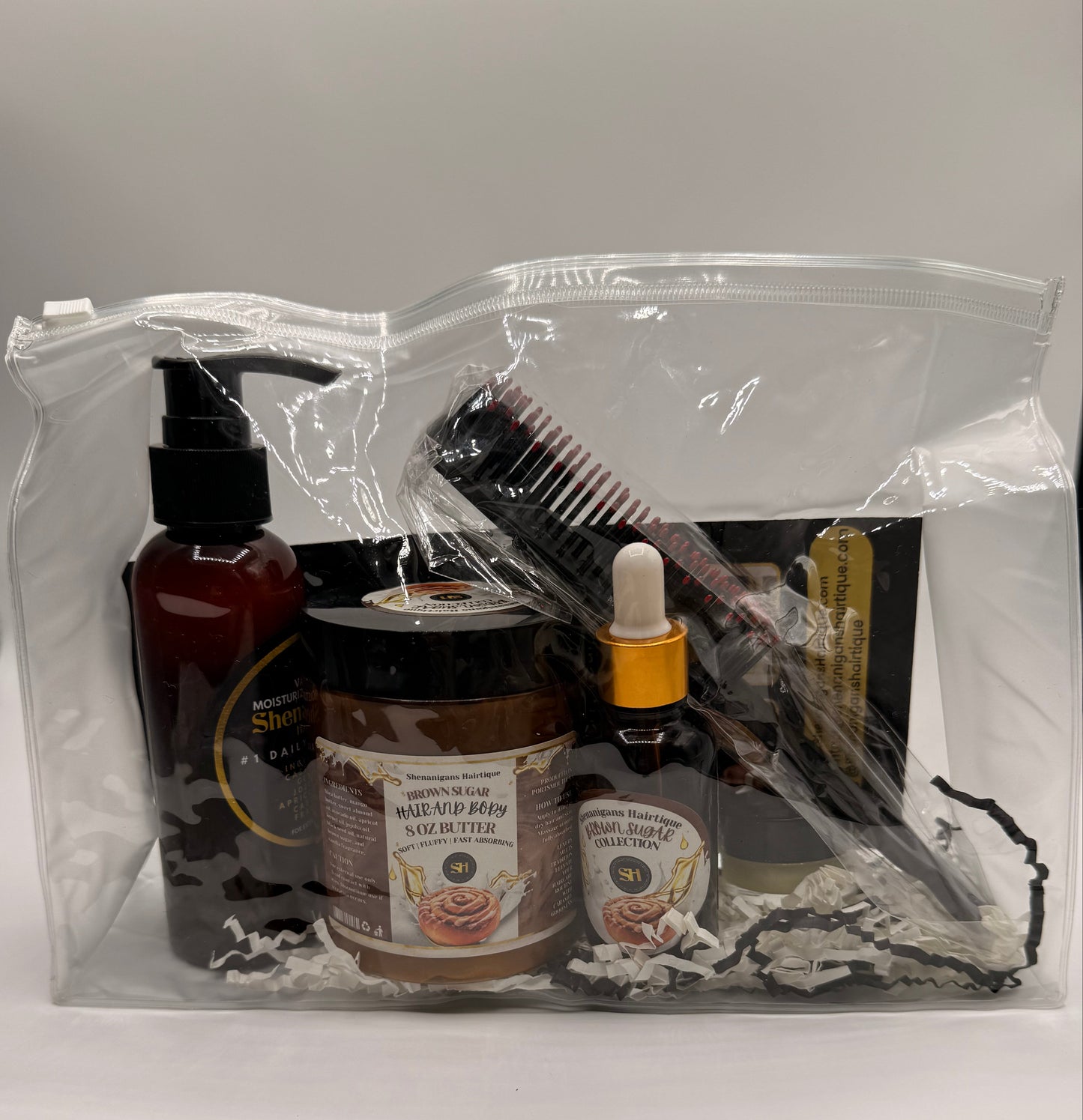 Set of Hair care product bundle including Brown Sugar Hair oil, Brown Sugar Butter, Moisturizing shampoo, and edge brush/detangling brush