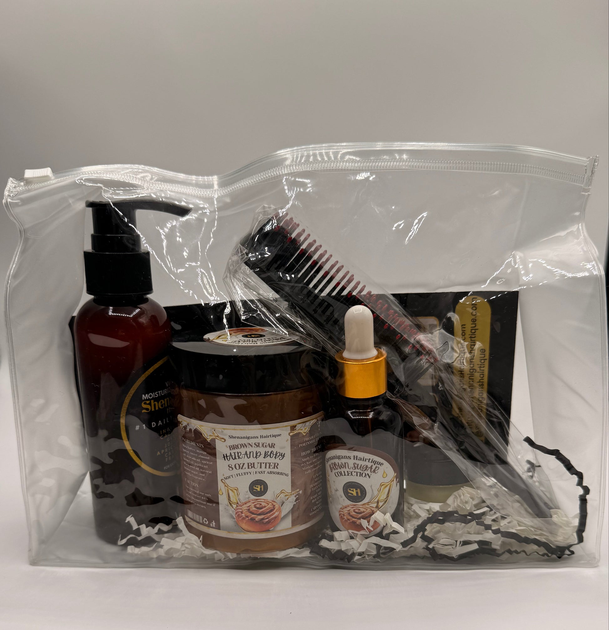 Set of Hair care product bundle including Brown Sugar Hair oil, Brown Sugar Butter, Moisturizing shampoo, and edge brush/detangling brush